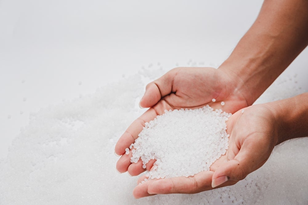 A close-up of plastic pellets which have significant environmental impacts related to microplastic pollution.